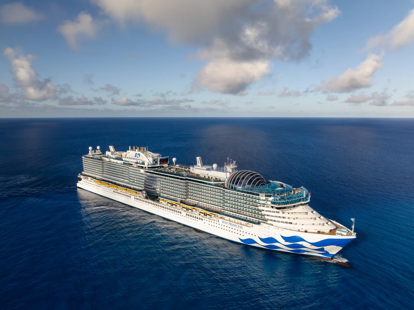 Sun Princess arriving at Princess Cays private island in the Bahamas, aerial view at sunset